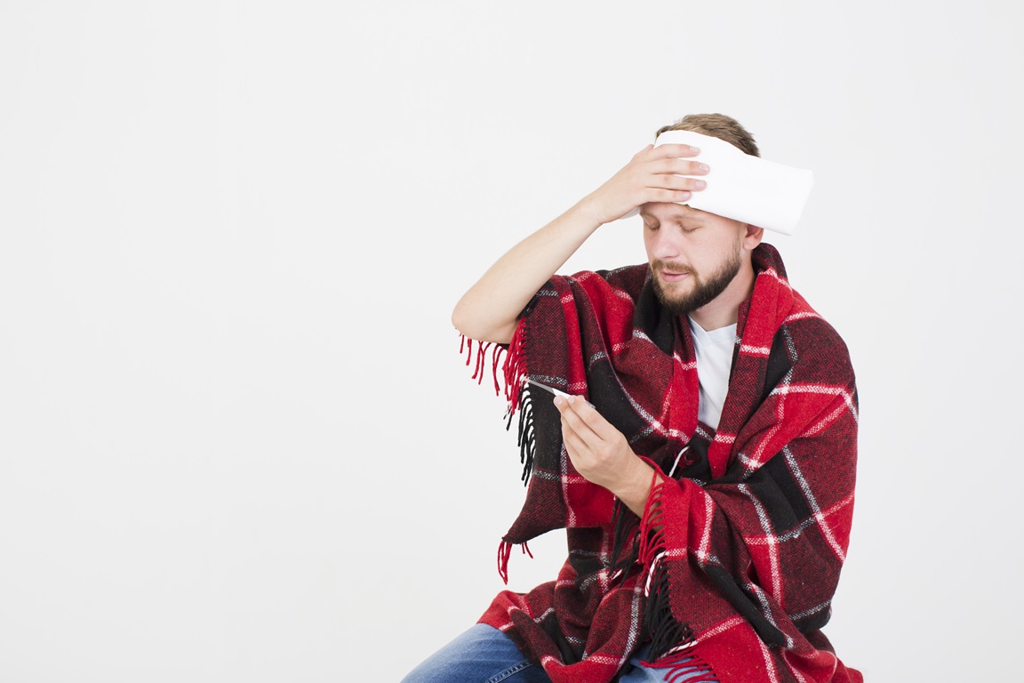 man measuring temperature