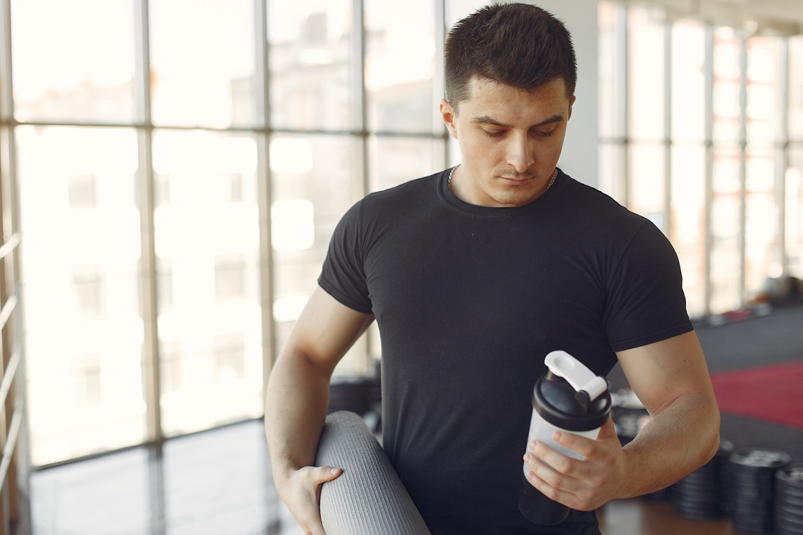 a handsome man is engaged in a gym