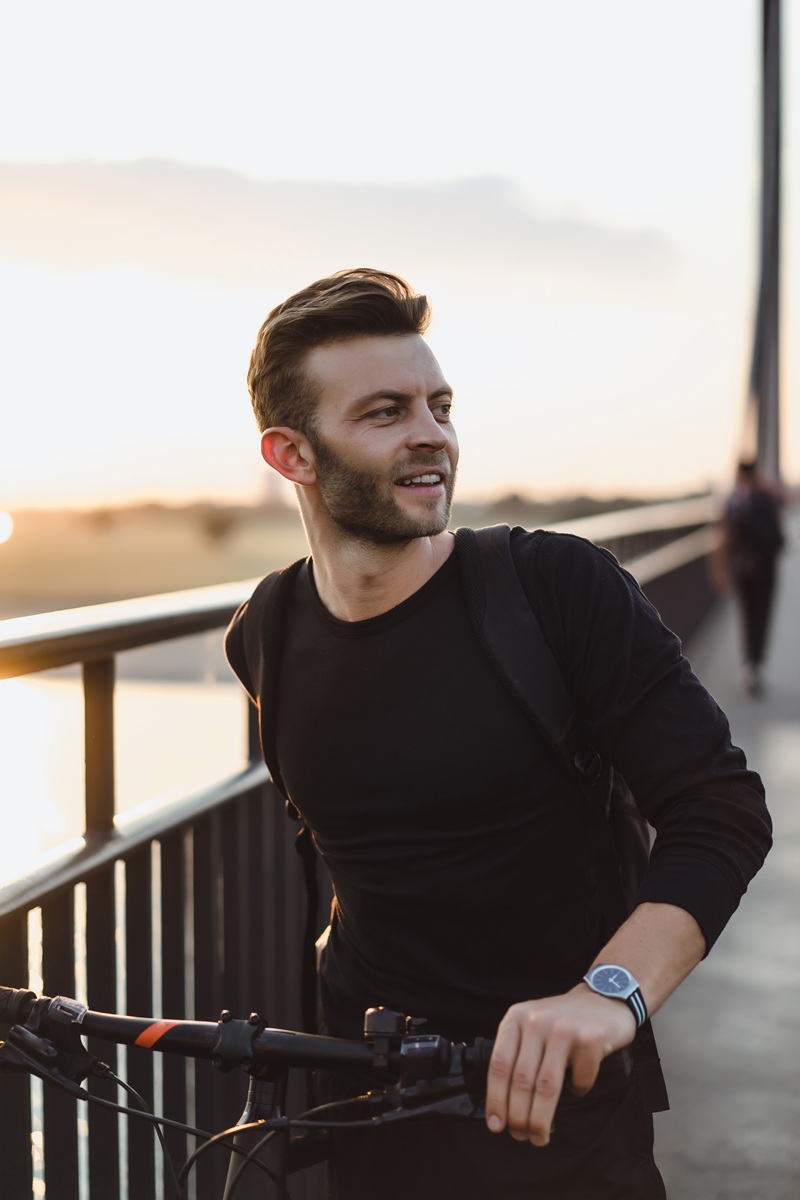 young sports man on a bicycle in a european city. sports in urba